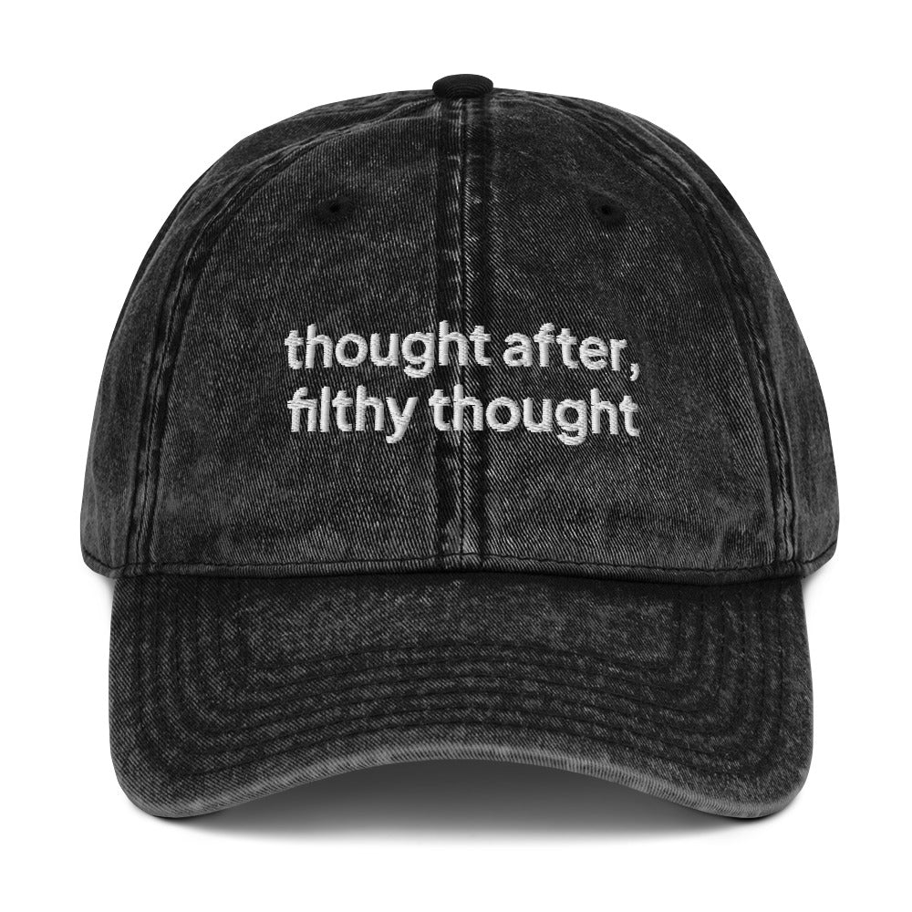 Black washed out vintage cotton twill dad cap with the slogan 'thought after, filthy thought' embroidered on it. 