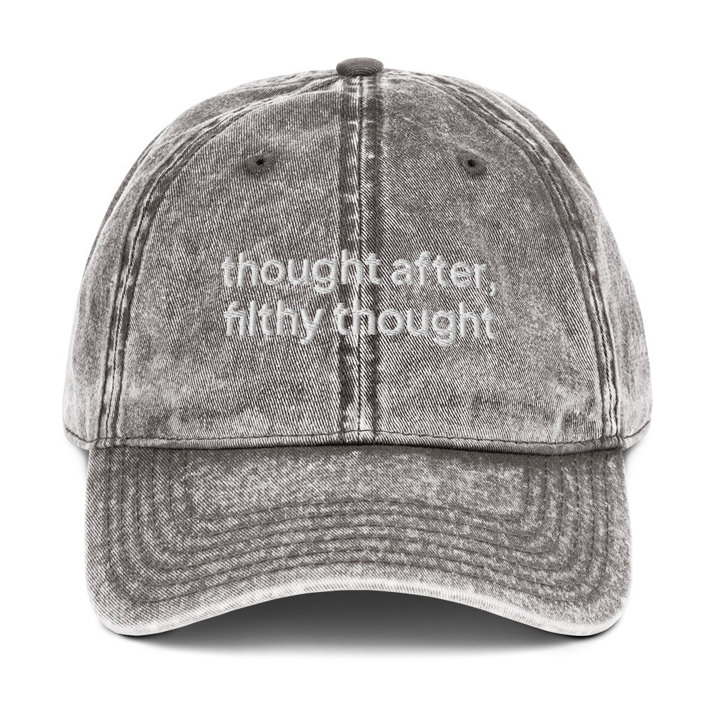 Grey washed out vintage cotton twill dad cap with the slogan 'thought after, filthy thought' embroidered on it. 