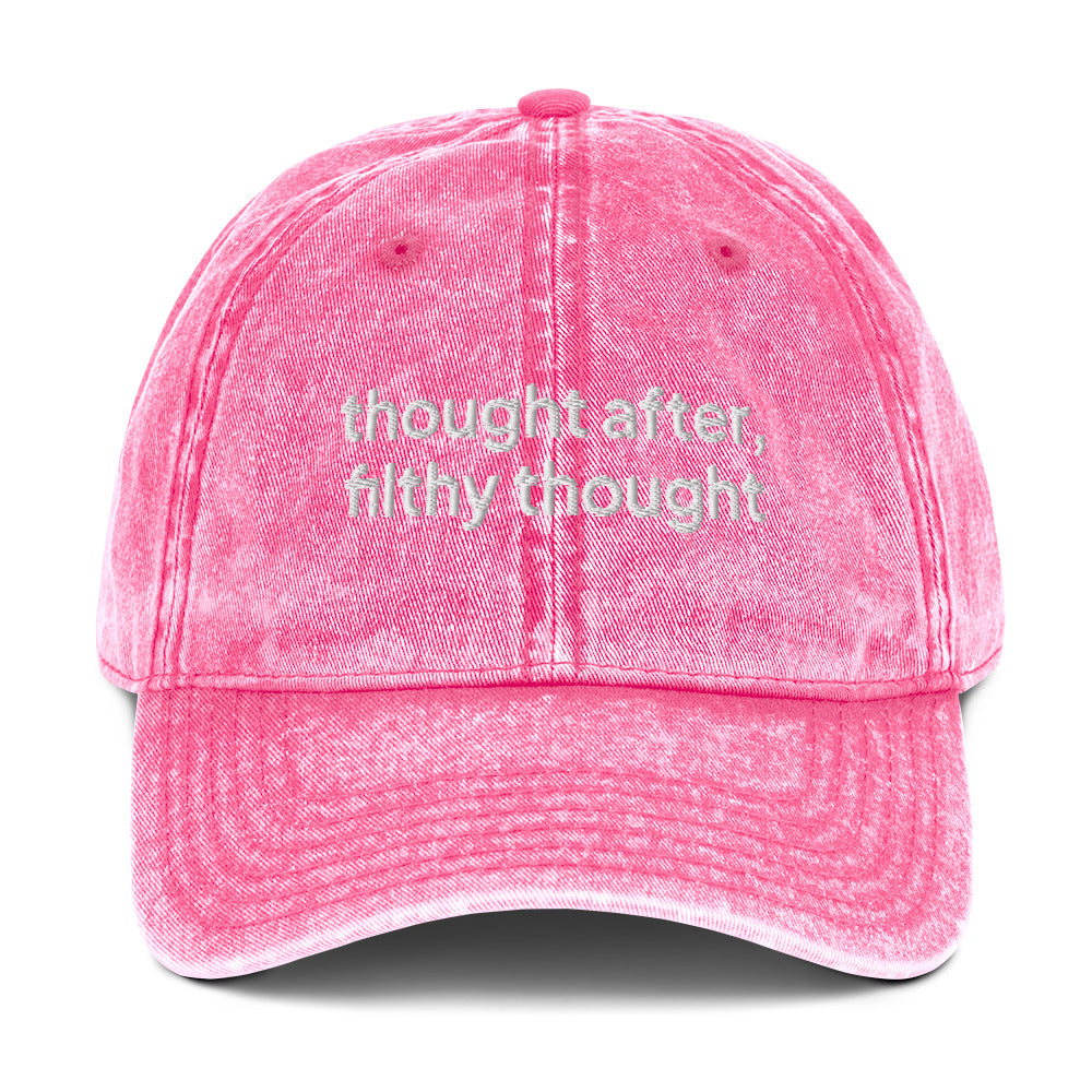 Pink washed out vintage cotton twill dad cap with the slogan 'thought after, filthy thought' embroidered on it. 